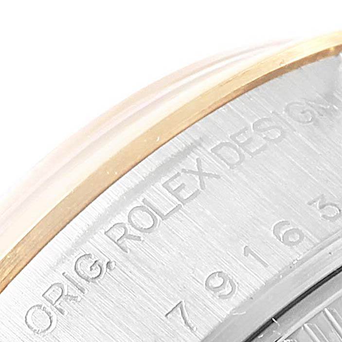 The image shows a close-up of the case back of a Rolex Datejust 79163 Women
s Steel and Gold (two tone) Grey Dial 79163 Women
s Steel and Gold (two tone) Grey Dial with engraved text.