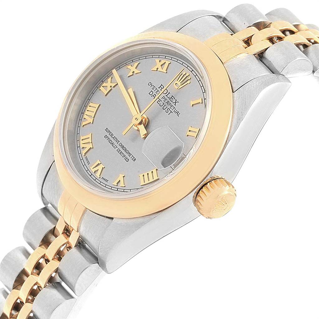 The image shows a side angle of a Rolex Datejust 79163 Women
s Steel and Gold (two tone) Grey Dial 79163 Women
s Steel and Gold (two tone) Grey Dial watch, highlighting the face, bezel, crown, and part of the bracelet.