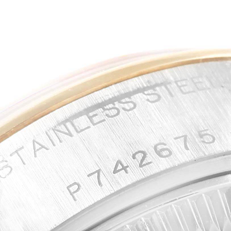 This image shows a close-up of the Rolex Datejust 79163 Women
s Steel and Gold (two tone) Grey Dial 79163 Women
s Steel and Gold (two tone) Grey Dial watch, focusing on the stainless steel case with visible engravings.