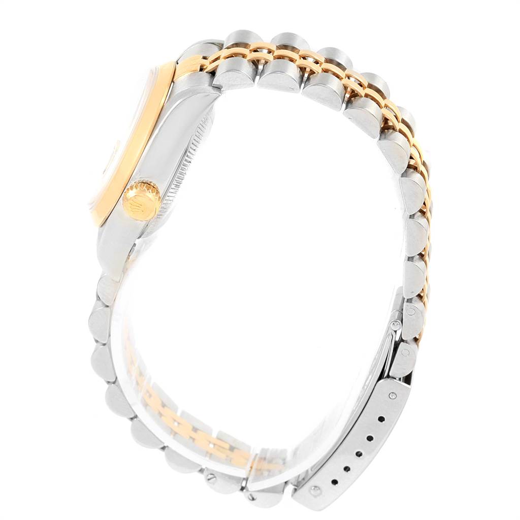 This image shows a side view of the Rolex Datejust 79163 Women
s Steel and Gold (two tone) Grey Dial 79163 Women
s Steel and Gold (two tone) Grey Dial watch, highlighting its two-tone bracelet and crown.