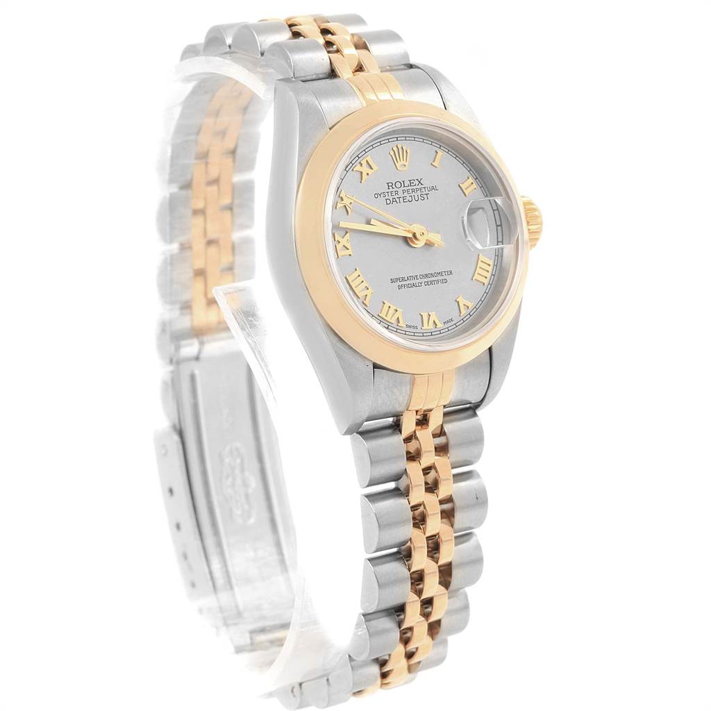 This image shows a Rolex Datejust 79163 Women
s Steel and Gold (two tone) Grey Dial 79163 Women
s Steel and Gold (two tone) Grey Dial watch at a three-quarter angle featuring its two-tone bracelet, face, bezel, and clasp.