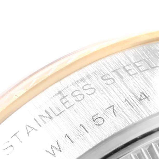 This image shows a close-up of the Datejust model by Rolex, focusing on the stainless steel markings on the caseback.