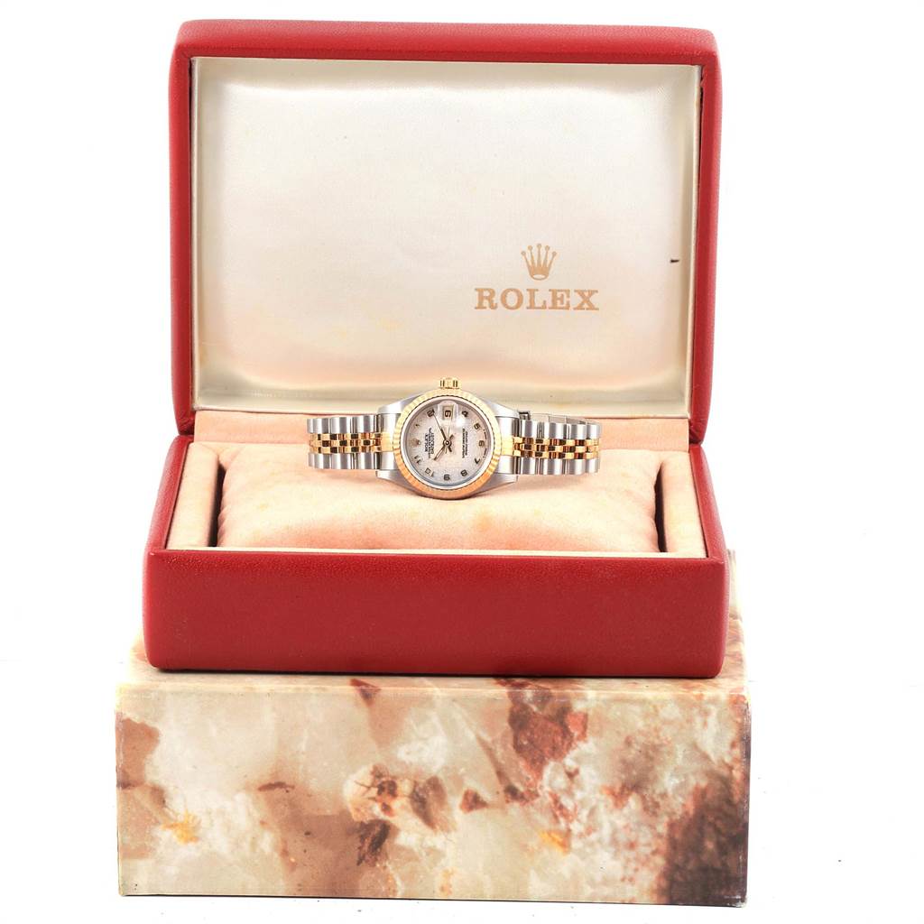 The Rolex Datejust 69173 Women's Stainless Steel Beige Dial 69173 Women's Stainless Steel Beige Dial watch is shown front-facing in its open box, highlighting the dial and jubilee bracelet.