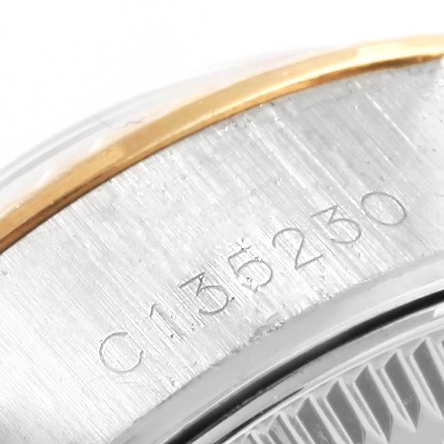 The image shows a close-up of the serial number and the bezel of a Rolex Datejust 69173 Women's Stainless Steel White Dial 69173 Women's Stainless Steel White Dial watch.