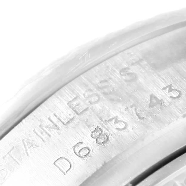 This image shows a close-up of the engraved serial number on the stainless steel case of a Rolex Datejust 179174 Women's Stainless Steel Mother of Pearl Dial 179174 Women's Stainless Steel Mother of Pearl Dial watch.
