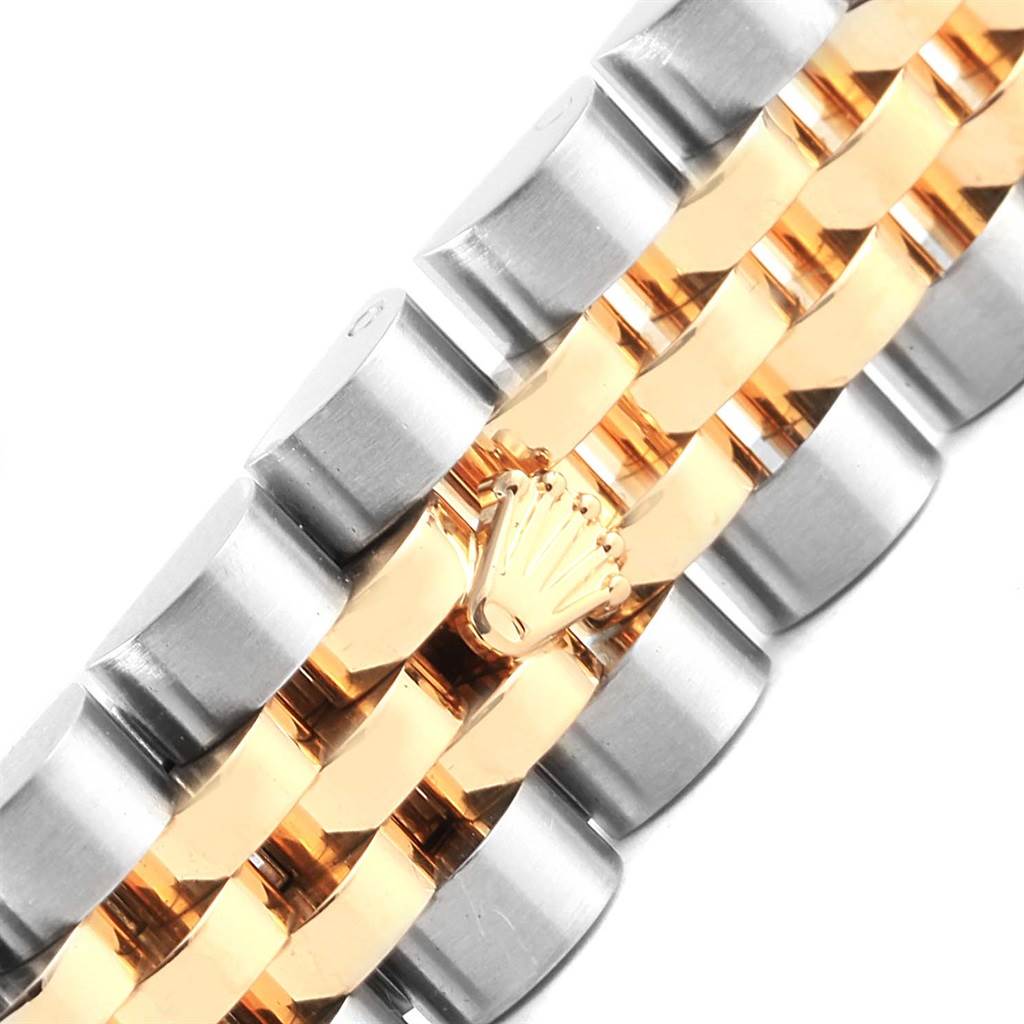 This image shows a close-up of the bracelet of the Rolex 179173 Men's Steel and Gold (two tone) Black Dial 179173 Men's Steel and Gold (two tone) Black Dial Datejust Steel Yellow Gold Diamond Ladies Watch 179173, highlighting the gold and steel links.