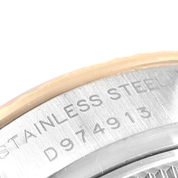 The image shows a close-up view of the case back edge of a Rolex 179173 Men's Steel and Gold (two tone) Black Dial 179173 Men's Steel and Gold (two tone) Black Dial Datejust Steel Yellow Gold Diamond Ladies Watch 179173 Box Card model.