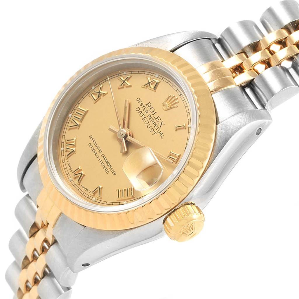 The image shows a close-up angled view of the Rolex Datejust 69163 Women's Stainless Steel Champagne Dial 69163 Women's Stainless Steel Champagne Dial watch, highlighting its gold dial, fluted bezel, and two-tone bracelet.