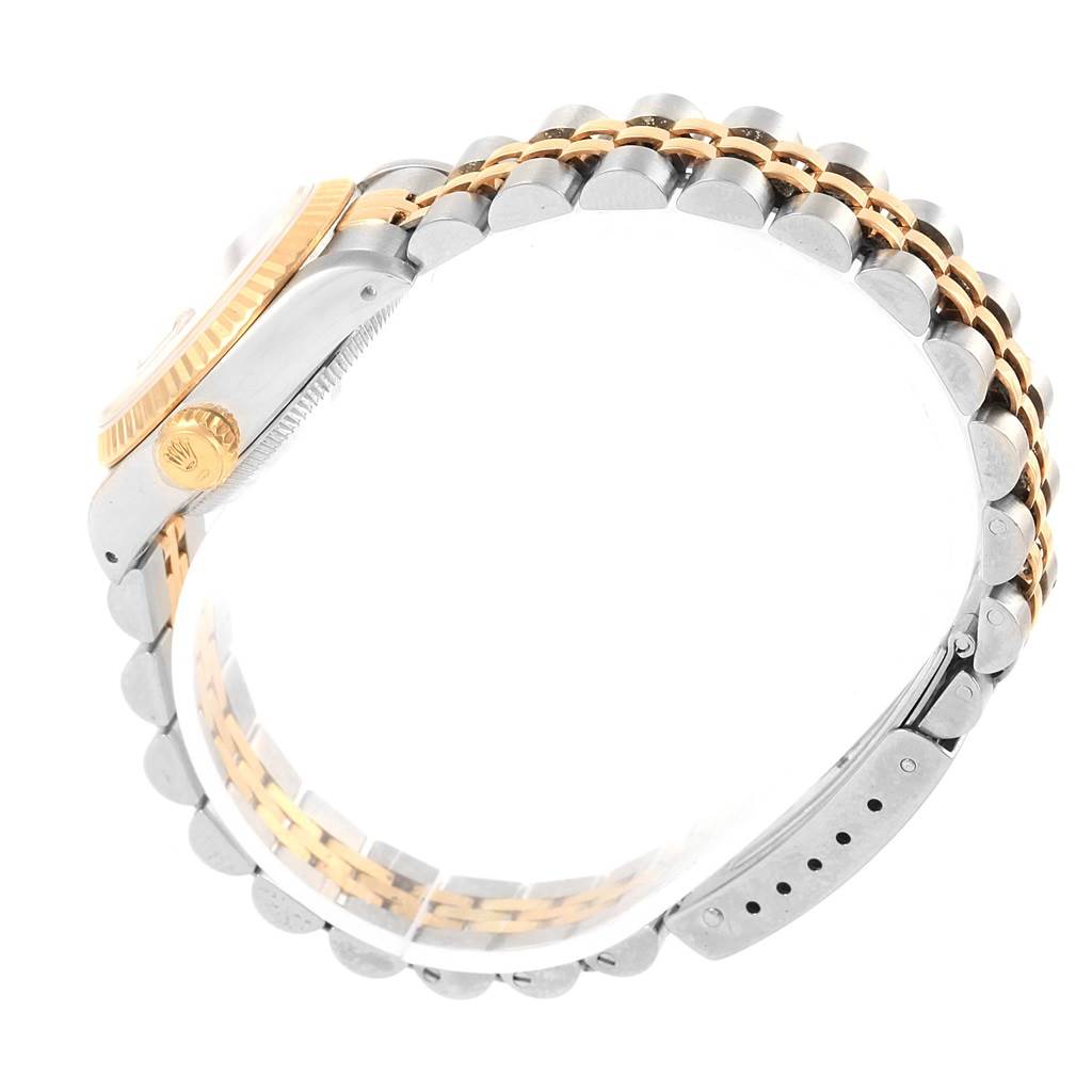 The image shows a side view of the Rolex Datejust 69163 Women's Stainless Steel Champagne Dial 69163 Women's Stainless Steel Champagne Dial model, highlighting its two-tone bracelet and part of the watch case.