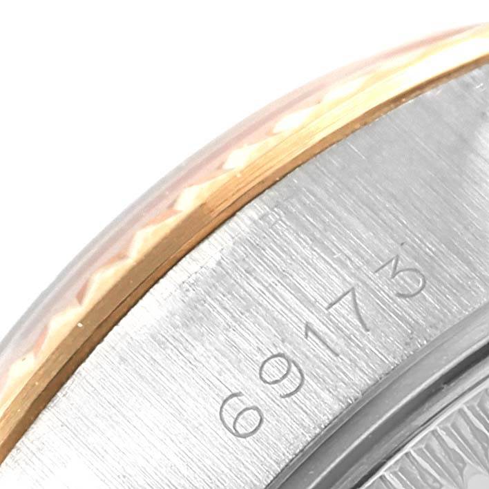 Close-up of the Rolex Datejust 69173 Women's Stainless Steel Blue Dial 69173 Women's Stainless Steel Blue Dial model showing the bezel and part of the case with the model number 69173 engraved.