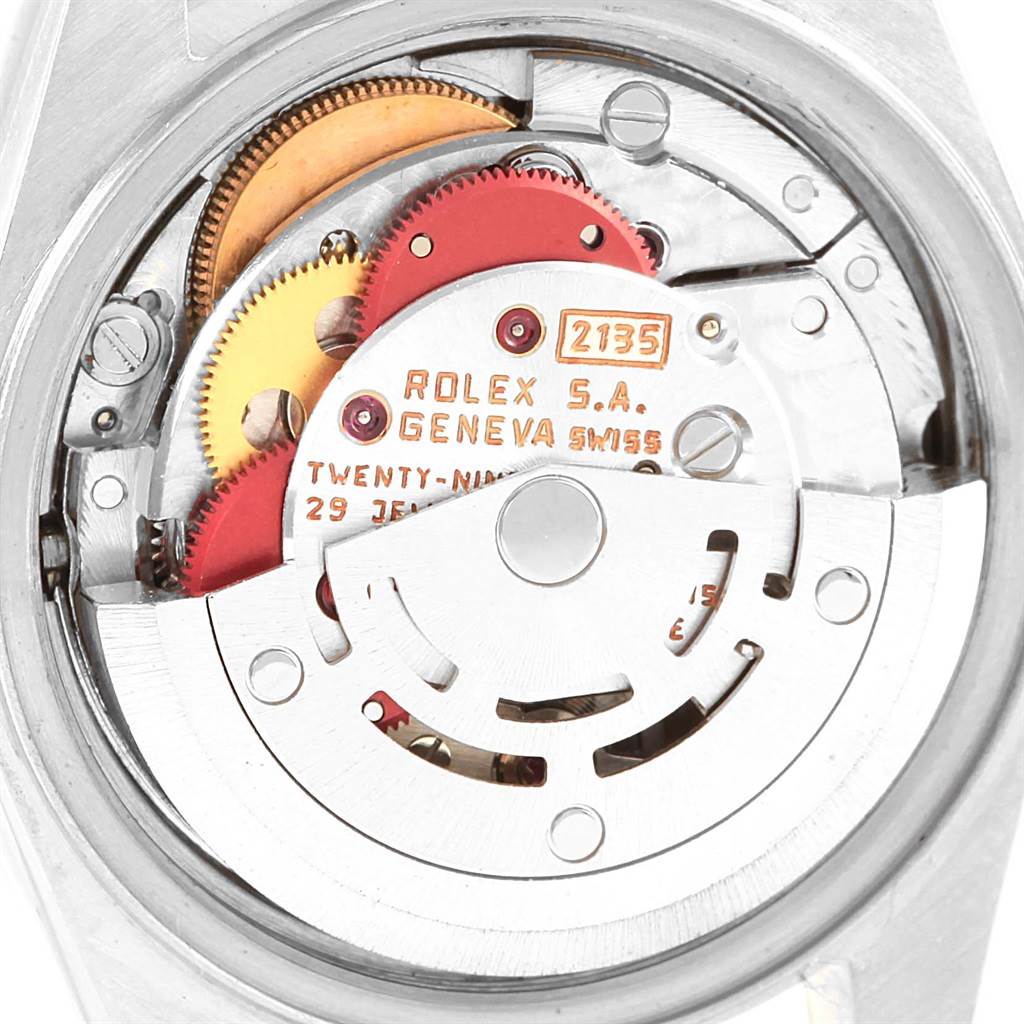 This image shows the internal mechanism of a Rolex Datejust 69173 Women's Stainless Steel Blue Dial 69173 Women's Stainless Steel Blue Dial watch from a top-down angle, highlighting gears and movement parts.