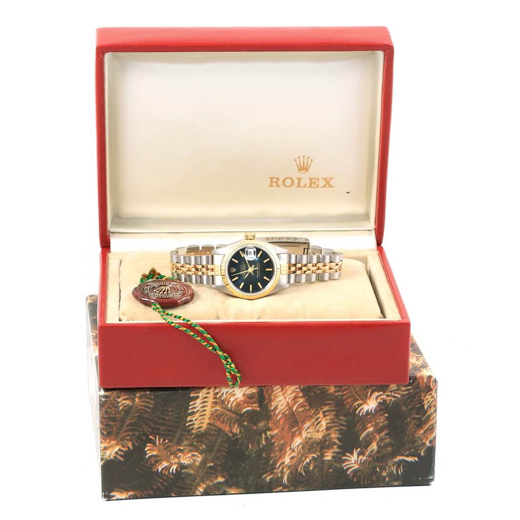The Rolex Datejust 69173 Women's Stainless Steel Blue Dial 69173 Women's Stainless Steel Blue Dial watch is shown in an open box, displaying its dial and two-tone bracelet from the front.