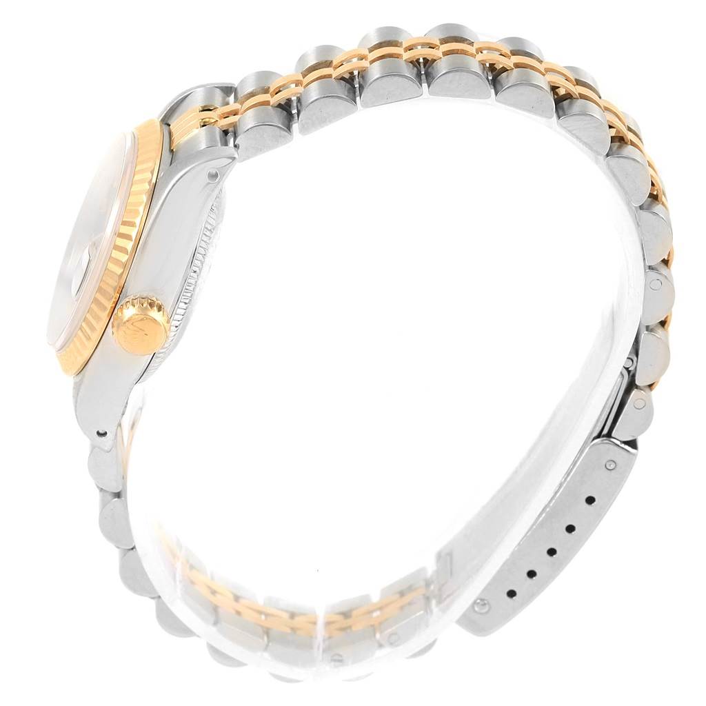 The image shows a side view of a Rolex Datejust 69173 Women's Stainless Steel Blue Dial 69173 Women's Stainless Steel Blue Dial model watch, highlighting its two-tone bracelet and crown.