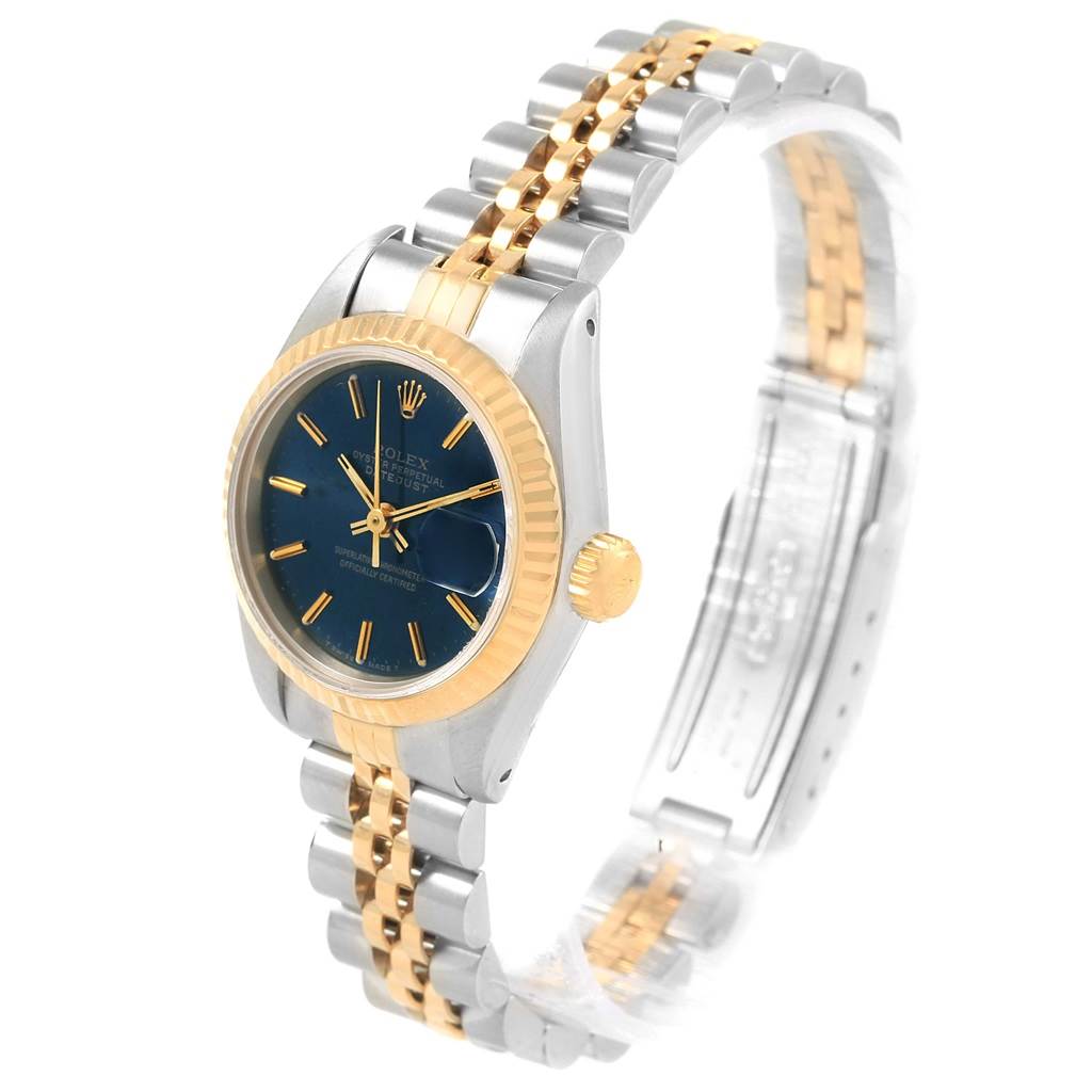 The Rolex Datejust 69173 Women's Stainless Steel Blue Dial 69173 Women's Stainless Steel Blue Dial watch is shown at a three-quarter angle, highlighting its two-tone bracelet, blue dial, and gold fluted bezel.