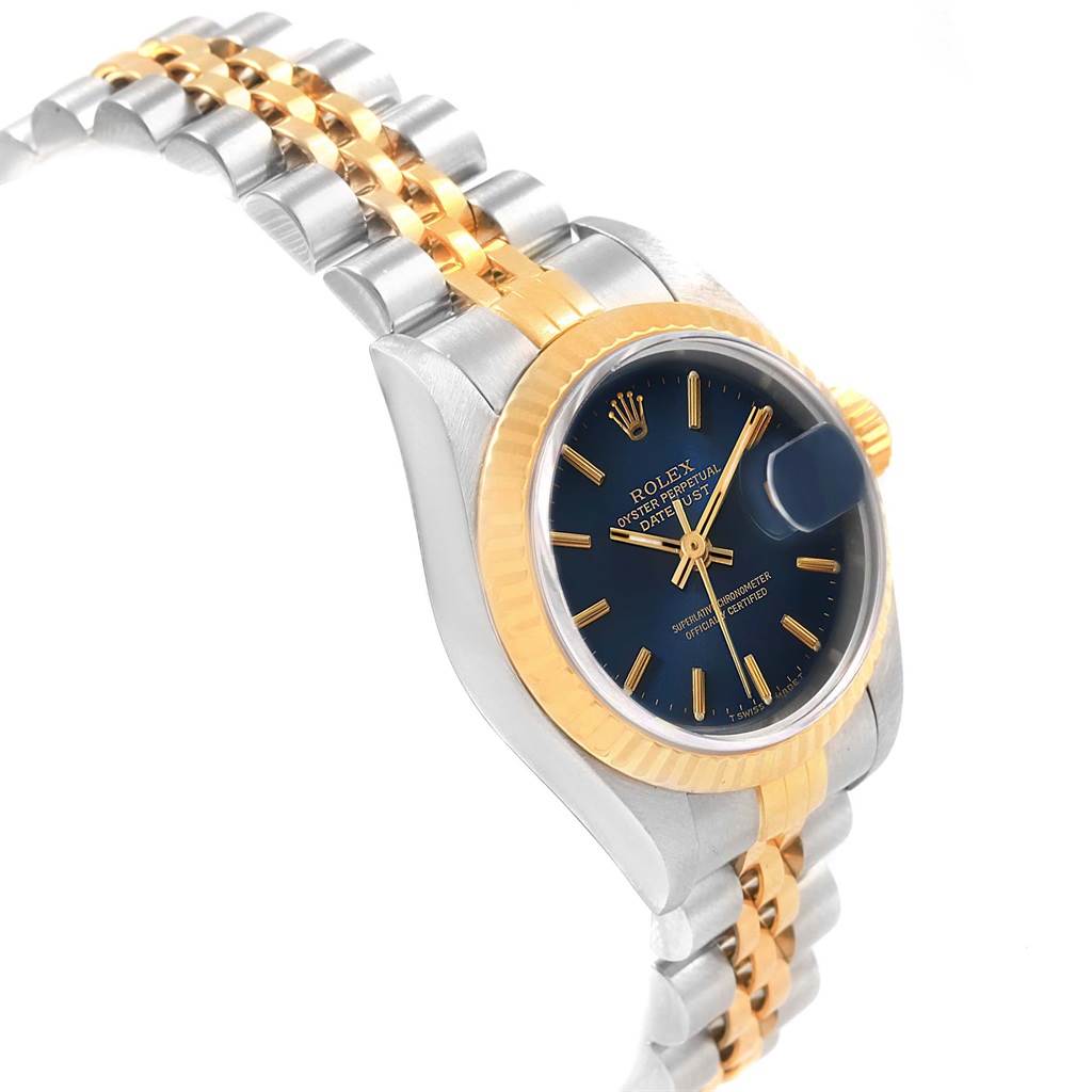 The image shows a side view of a Rolex Datejust 69173 Women's Stainless Steel Blue Dial 69173 Women's Stainless Steel Blue Dial watch, highlighting its two-tone bracelet, dial, and fluted bezel.