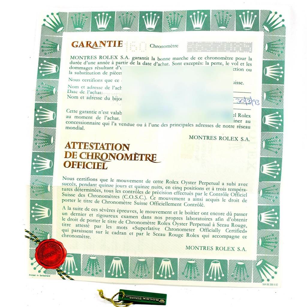 This image shows a Garantie and Attestation de Chronomètre Officiel document for a Rolex Datejust 69173 Women's Stainless Steel Blue Dial 69173 Women's Stainless Steel Blue Dial watch, along with a hang tag.