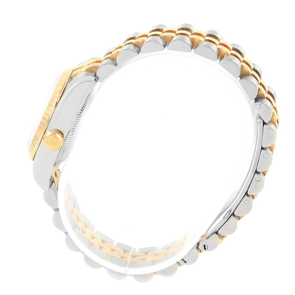 The image shows a side view of a Rolex Datejust 179173 Women's Steel and Gold (two tone) White Dial 179173 Women's Steel and Gold (two tone) White Dial watch, highlighting its case and two-tone bracelet.