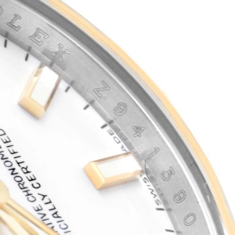 This close-up angle of the Rolex Datejust 179173 Women's Steel and Gold (two tone) White Dial 179173 Women's Steel and Gold (two tone) White Dial watch shows the chapter ring and part of the dial with hour markers.
