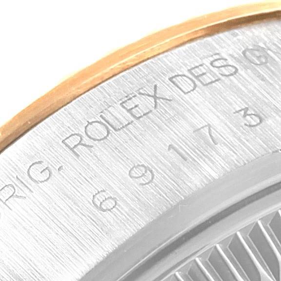 This image shows a close-up of the side engraving of a Rolex Datejust 69173 Women's Stainless Steel White Dial 69173 Women's Stainless Steel White Dial watch.