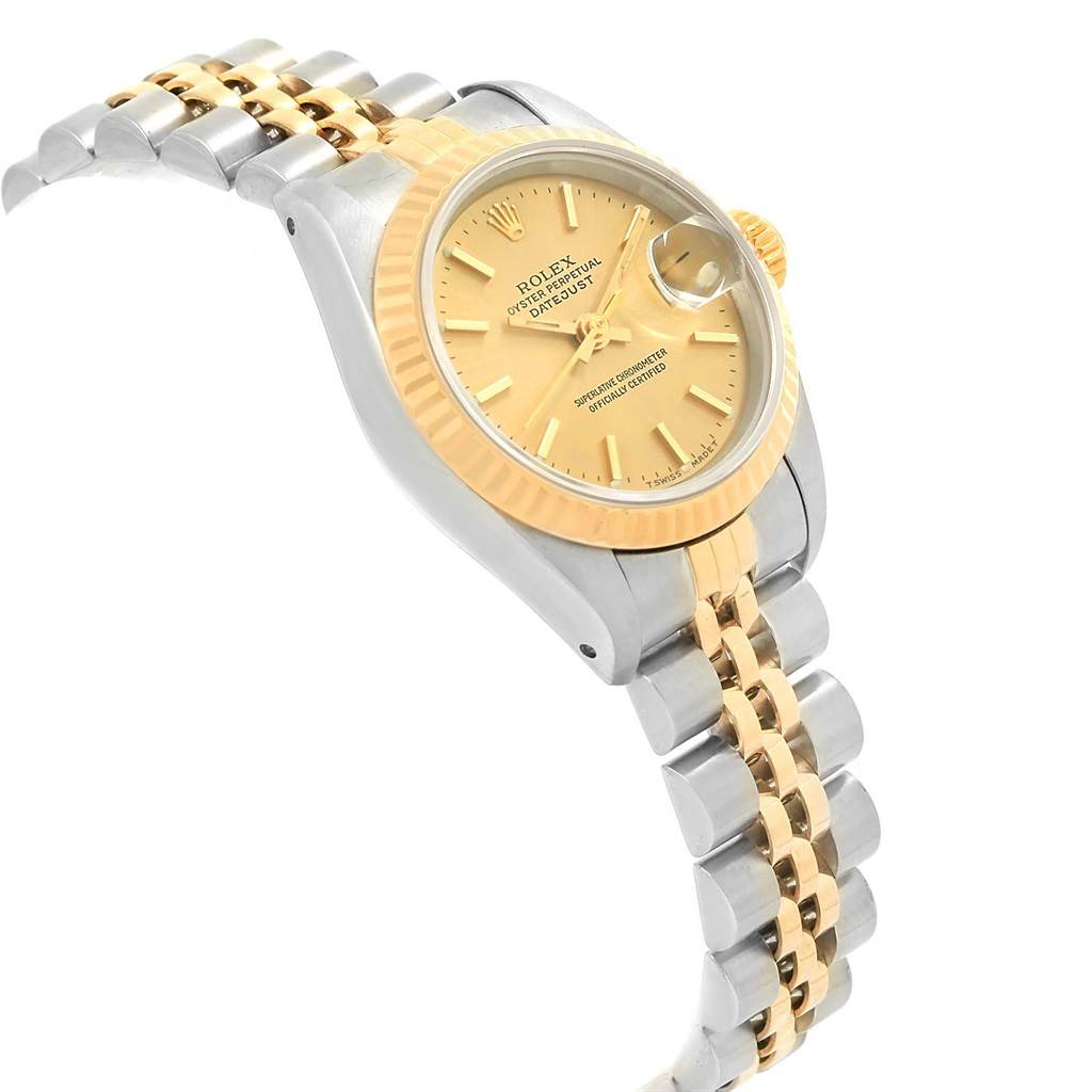 The image shows a Rolex Datejust 69173 Women's Stainless Steel White Dial 69173 Women's Stainless Steel White Dial watch from a side angle, highlighting its gold and silver bracelet, gold bezel, and dial.