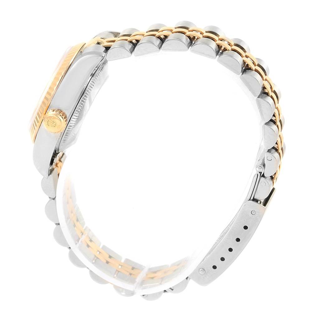 The image shows a side view of a Rolex Datejust 79173 Women's Stainless Steel White Dial 79173 Women's Stainless Steel White Dial watch, highlighting the crown, bezel, and two-tone bracelet with clasp.