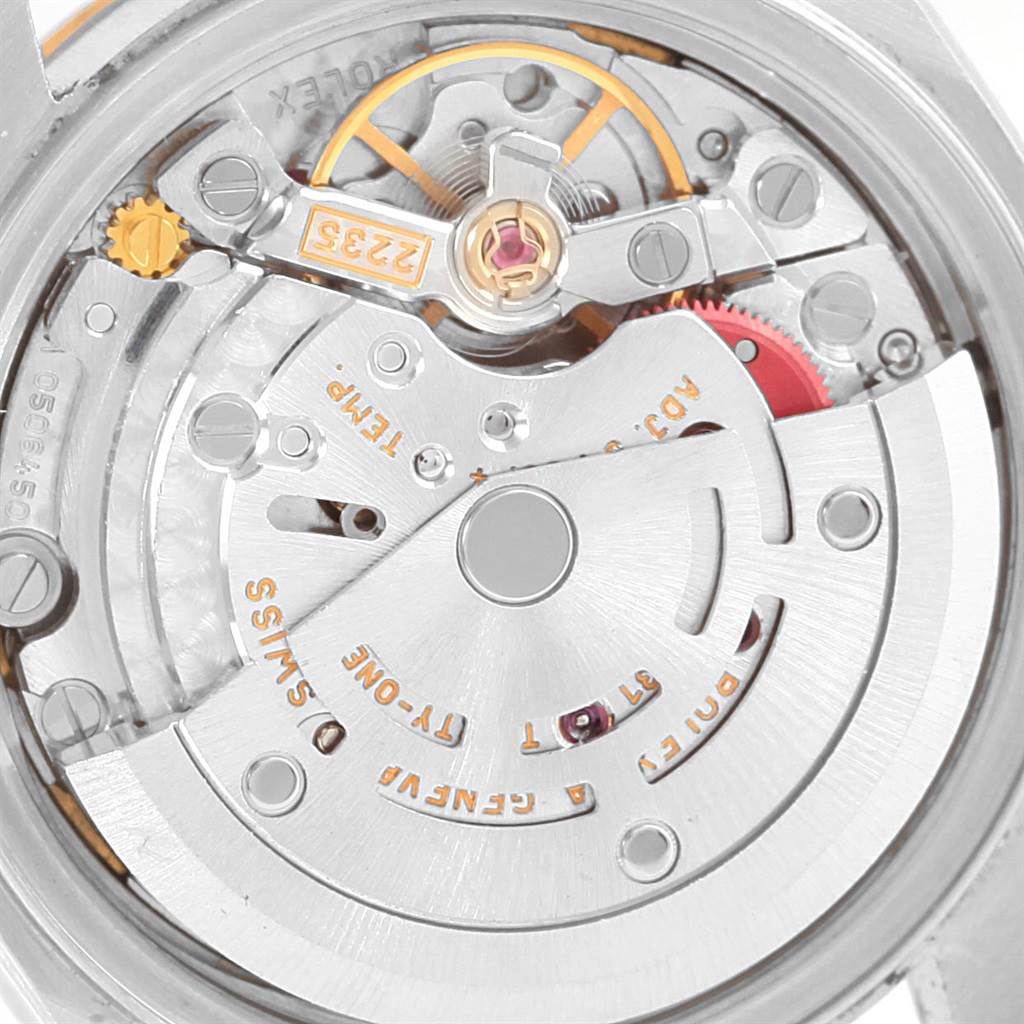 The image shows the inner mechanical movement of a Rolex Datejust 79173 Women's Stainless Steel White Dial 79173 Women's Stainless Steel White Dial watch, highlighting its intricate gears and components from a close-up angle.