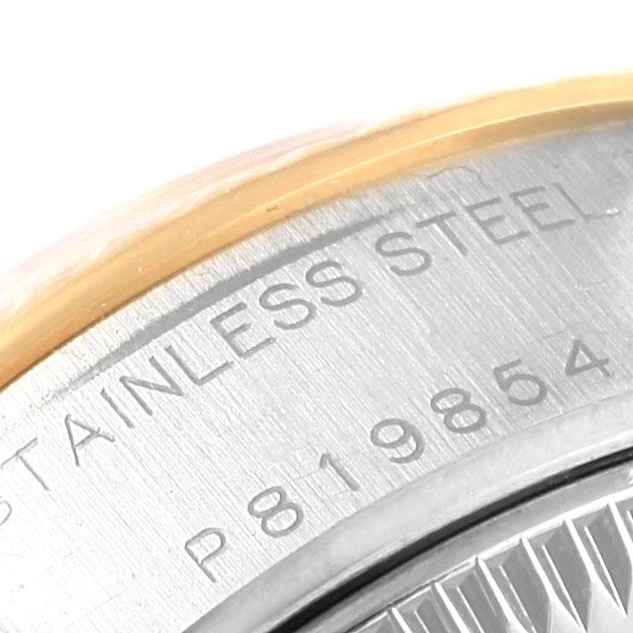 The image shows a close-up of the back case engraving of a Rolex Datejust 79173 Women's Stainless Steel White Dial 79173 Women's Stainless Steel White Dial watch, highlighting the stainless steel text and part of the serial number.
