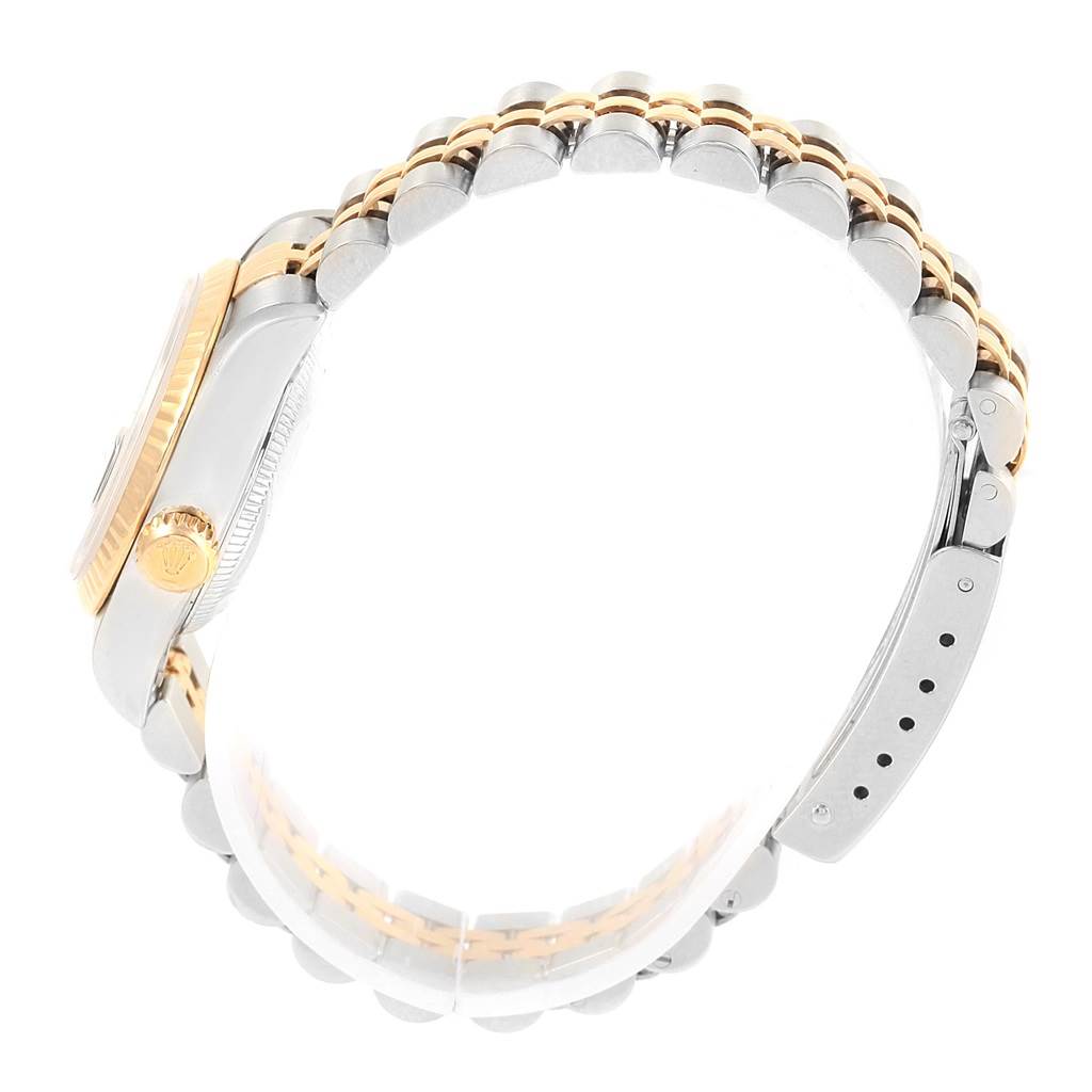 The image shows a side view of a Rolex Datejust 79173 Women's Stainless Steel Black Dial 79173 Women's Stainless Steel Black Dial watch, highlighting the crown, case, and two-tone bracelet.