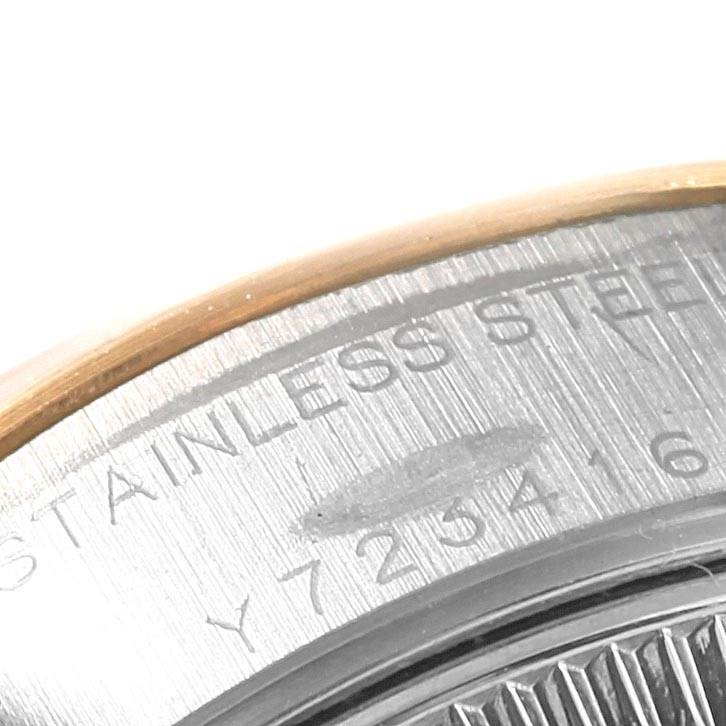 The image shows a close-up of the serial number and "STAINLESS STEEL" engraving on the back case of the Rolex Datejust 79173 Women's Stainless Steel Black Dial 79173 Women's Stainless Steel Black Dial watch.