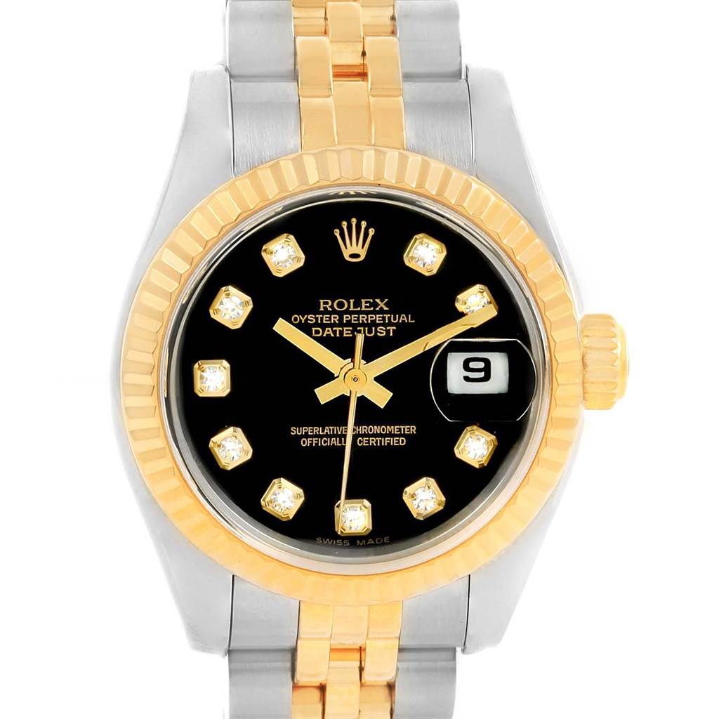 This image shows a Rolex Datejust 79173 Women's Stainless Steel Black Dial 79173 Women's Stainless Steel Black Dial watch from a front angle, highlighting its black dial, gold bezel, diamond hour markers, and two-tone bracelet.