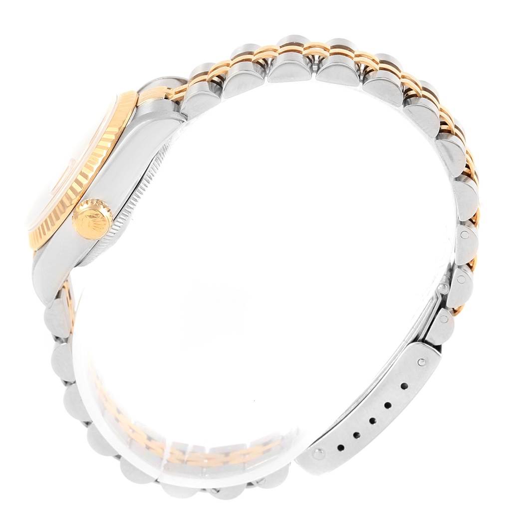 The image shows a side view of a Rolex Datejust 69173 Women's Stainless Steel Champagne Dial 69173 Women's Stainless Steel Champagne Dial watch highlighting its crown and two-tone bracelet.