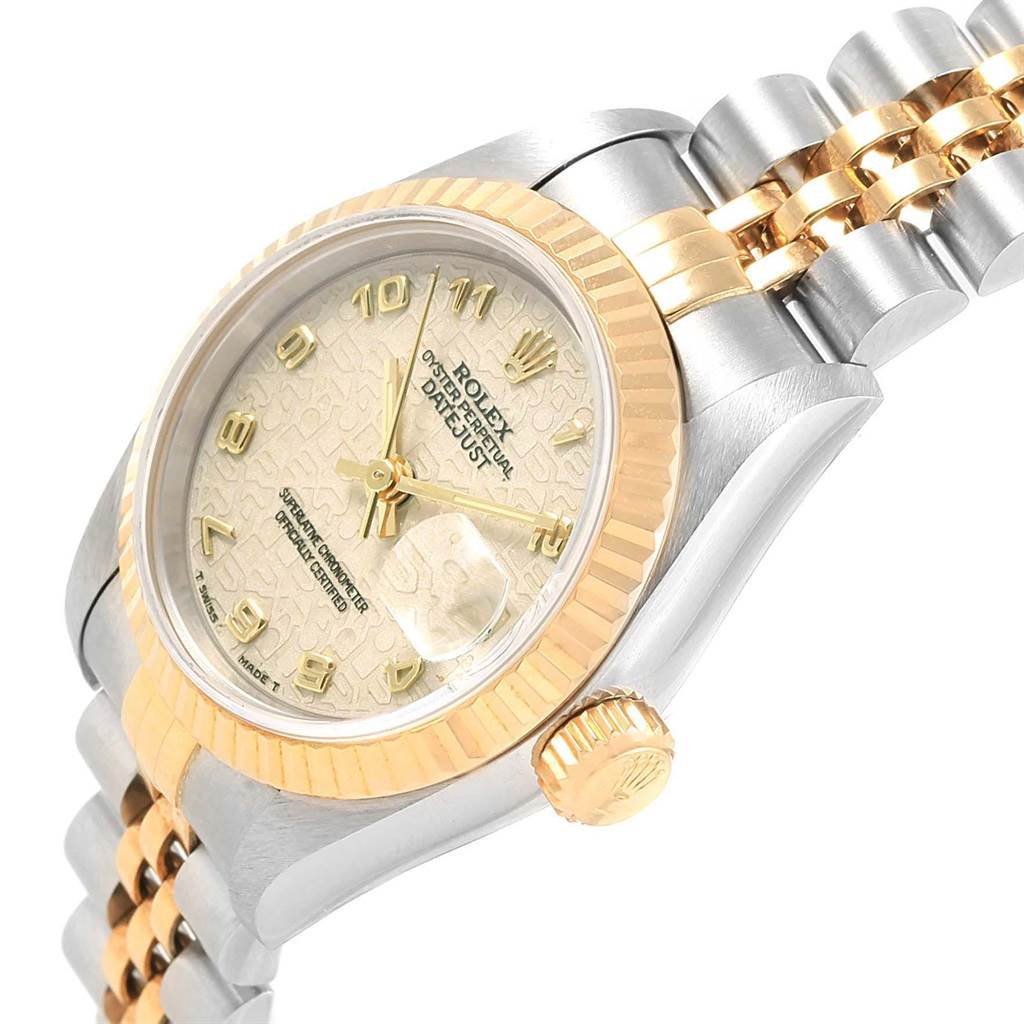 This image shows a side angle of the Rolex Datejust 69173 Women's Stainless Steel Beige Dial 69173 Women's Stainless Steel Beige Dial watch, highlighting the face, bezel, crown, and part of the bracelet.