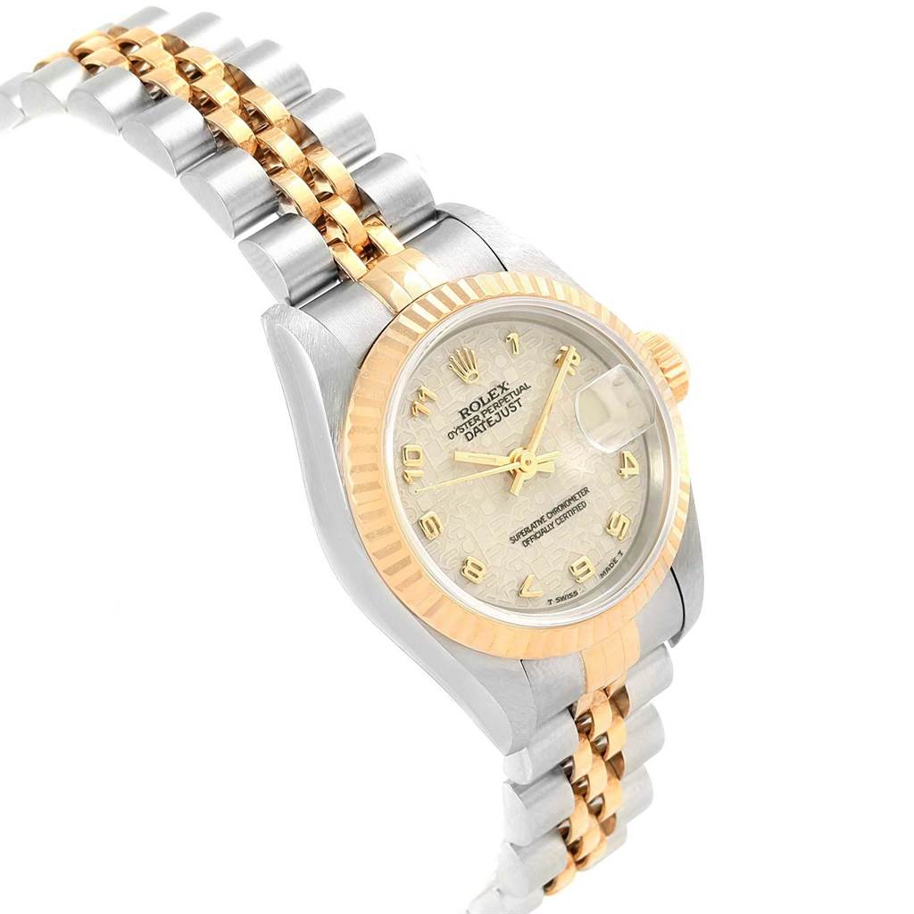 The Rolex Datejust 69173 Women's Stainless Steel Beige Dial 69173 Women's Stainless Steel Beige Dial watch is shown at an angled view, displaying its face, case, bezel, and two-tone bracelet.