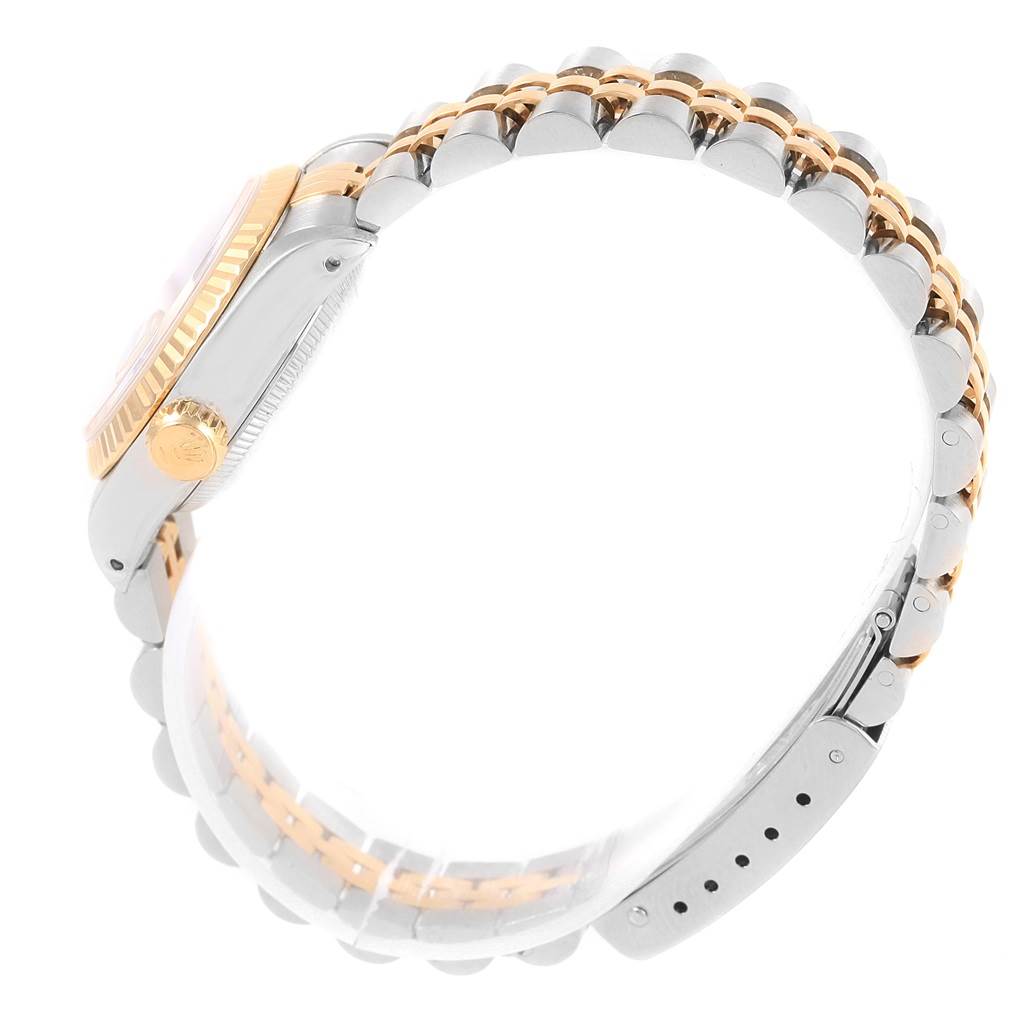 This image shows a side view of a Rolex Datejust 69173 Women's Stainless Steel Beige Dial 69173 Women's Stainless Steel Beige Dial watch, highlighting the crown, bezel, and two-tone bracelet.