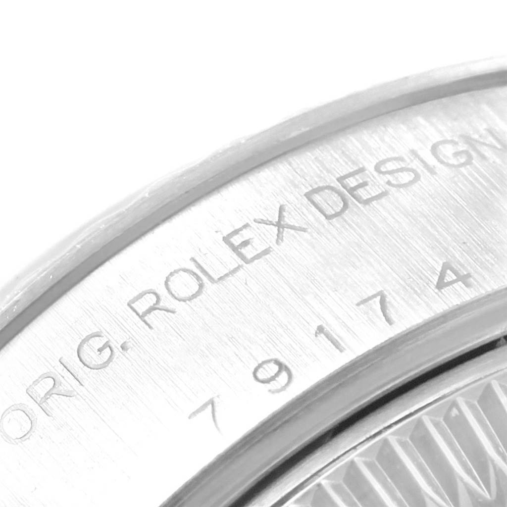 The image shows a close-up of the engraved caseback and model number of a Rolex Datejust 79174 Women's Stainless Steel White Dial 79174 Women's Stainless Steel White Dial watch.