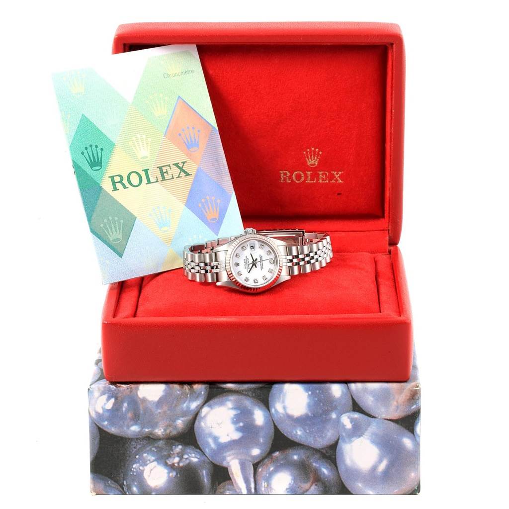 The Rolex Datejust 79174 Women's Stainless Steel White Dial 79174 Women's Stainless Steel White Dial watch is displayed front-facing, inside its original red box with a booklet.