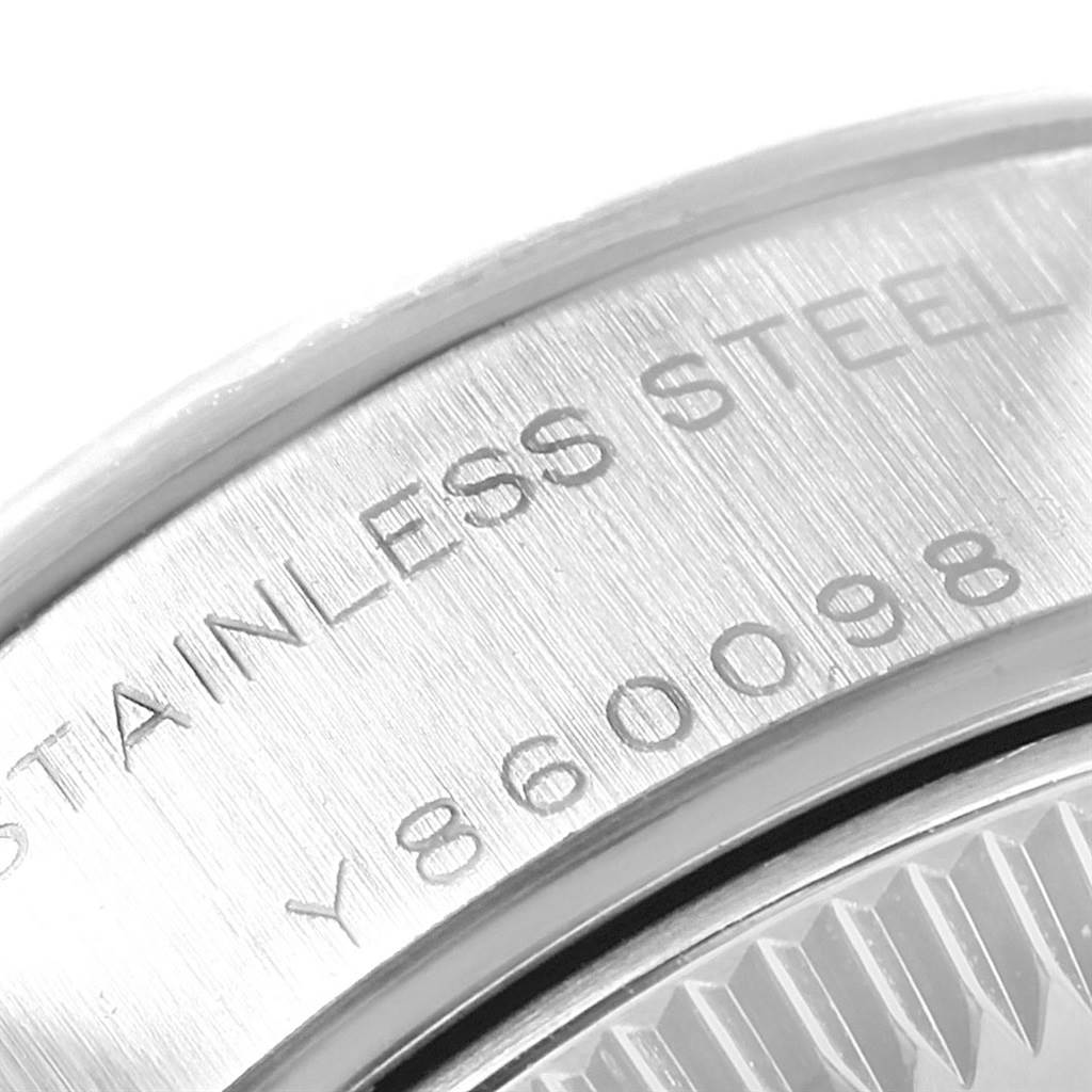 This close-up image shows the case back side of a Rolex Datejust 79174 Women's Stainless Steel White Dial 79174 Women's Stainless Steel White Dial watch, highlighting the stainless steel and etching details.