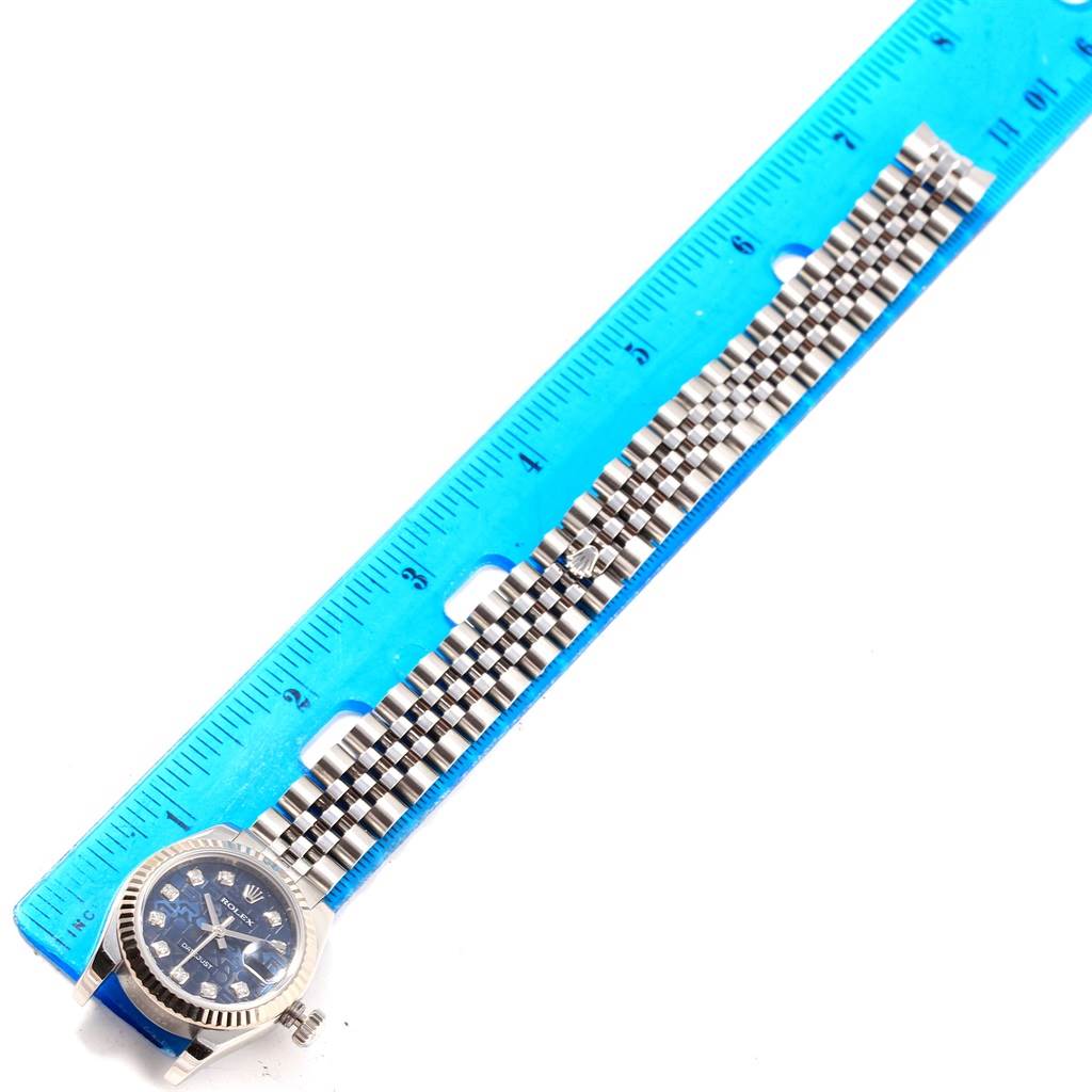 The image shows the face and bracelet of a Rolex Datejust 179174 Women's Stainless Steel Blue Dial 179174 Women's Stainless Steel Blue Dial watch, aligned next to a ruler for scale.