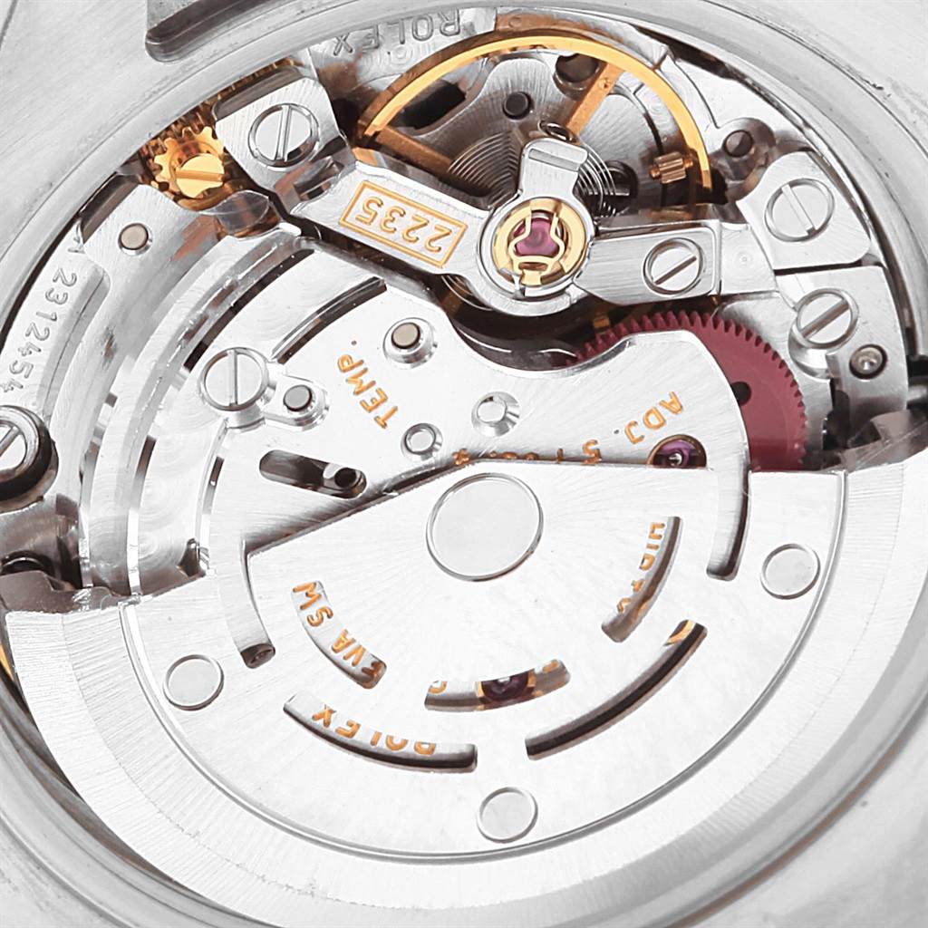 This image shows a close-up of the movement mechanism inside a Rolex Datejust 179174 Women's Stainless Steel Blue Dial 179174 Women's Stainless Steel Blue Dial watch.