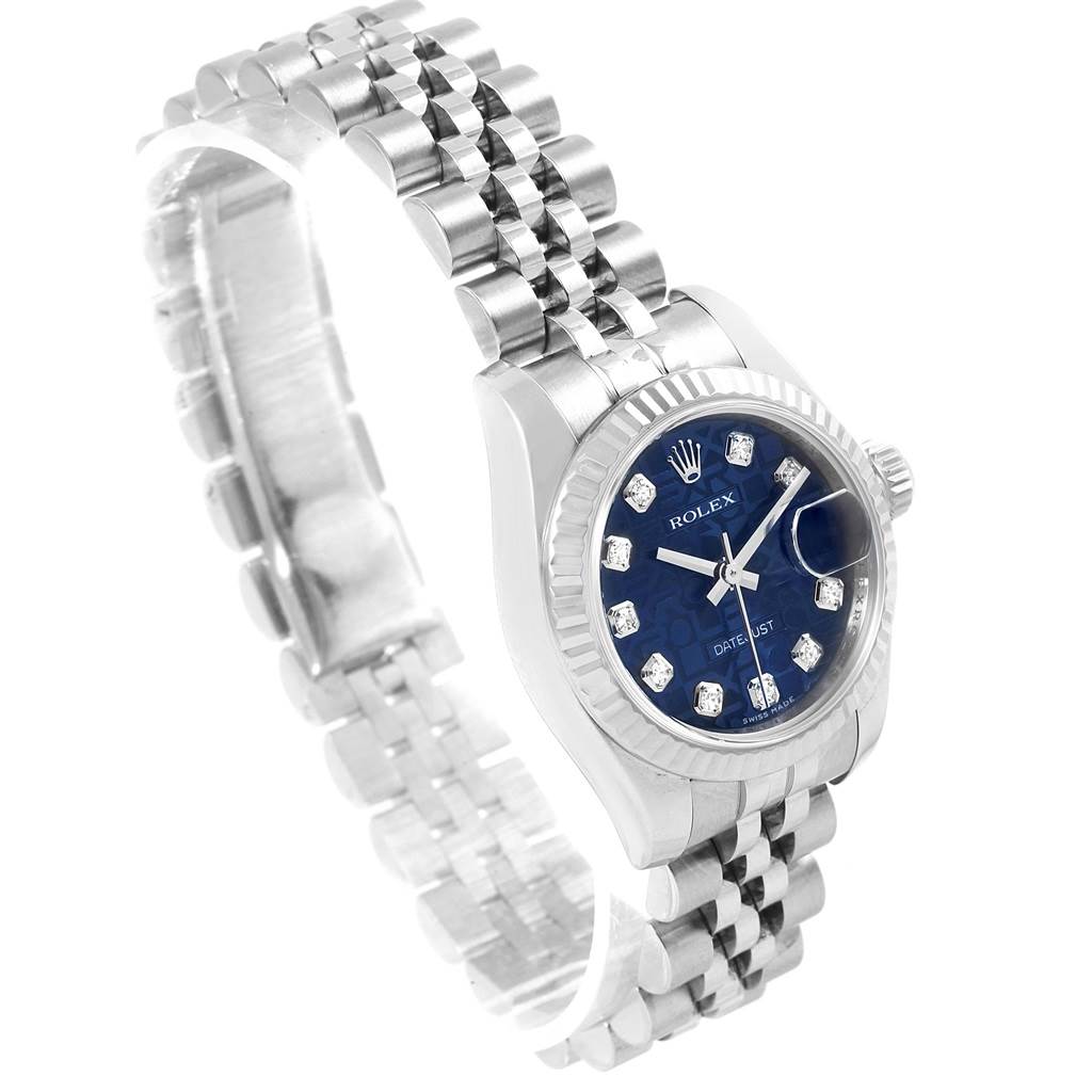The Rolex Datejust 179174 Women's Stainless Steel Blue Dial 179174 Women's Stainless Steel Blue Dial watch is shown at a 3/4 angle, highlighting the dial, bracelet, bezel, and crown.