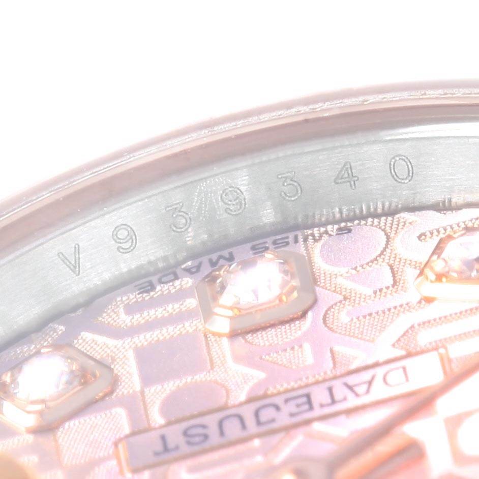 The image shows a close-up of the dial and inner case edge of a Rolex Datejust 179171 Women
s Steel and Gold (two tone) Pink Dial 179171 Women
s Steel and Gold (two tone) Pink Dial, featuring serial numbers and diamond markers.