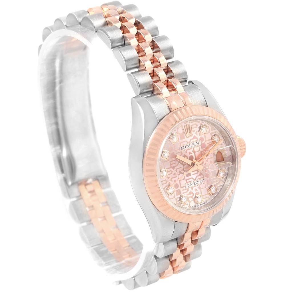 The image shows a Rolex Datejust 179171 Women
s Steel and Gold (two tone) Pink Dial 179171 Women
s Steel and Gold (two tone) Pink Dial watch from an elevated angle, highlighting the face, bezel, and two-tone metal bracelet.