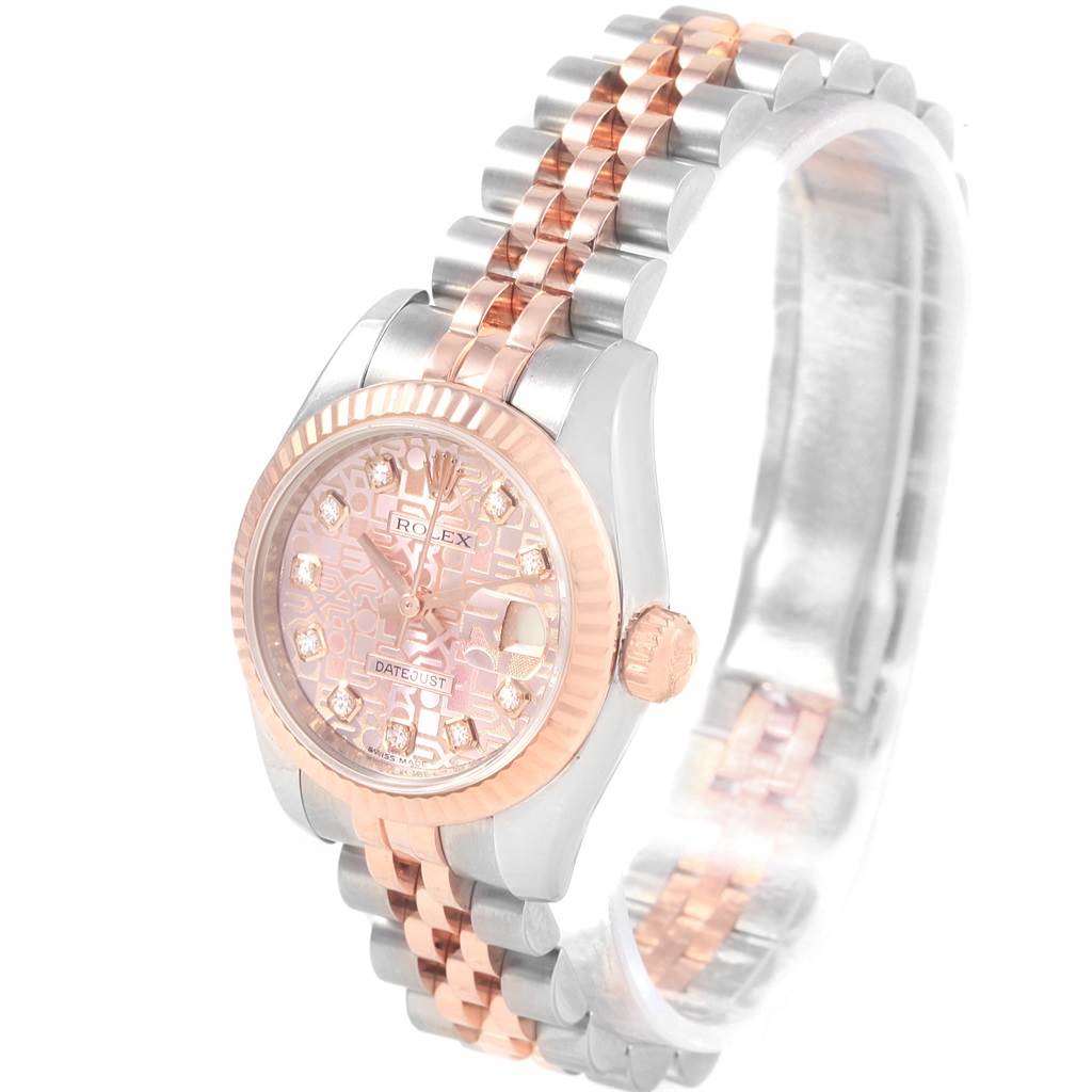 The image shows a Rolex Datejust 179171 Women
s Steel and Gold (two tone) Pink Dial 179171 Women
s Steel and Gold (two tone) Pink Dial watch at an angle highlighting its face, bezel, and two-tone bracelet.