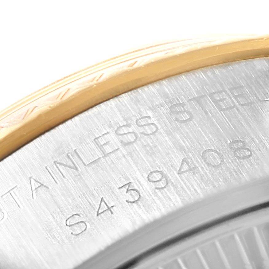 This image shows a close-up of the side engraving and part of the bezel of a Rolex Datejust 69173 Women's Stainless Steel Champagne Dial 69173 Women's Stainless Steel Champagne Dial watch.