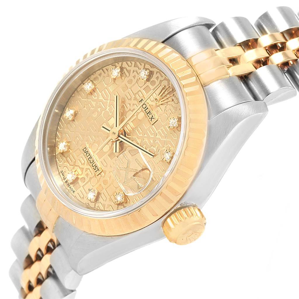 The Rolex Datejust 69173 Women's Stainless Steel Champagne Dial 69173 Women's Stainless Steel Champagne Dial watch is shown at an angled view, highlighting the champagne dial, fluted bezel, and two-tone Jubilee bracelet.