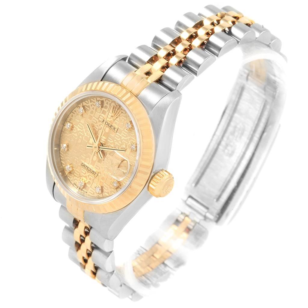 This image shows a Rolex Datejust 69173 Women's Stainless Steel Champagne Dial 69173 Women's Stainless Steel Champagne Dial watch from a three-quarter angle, highlighting its gold-tone bezel, dial, and two-tone bracelet.