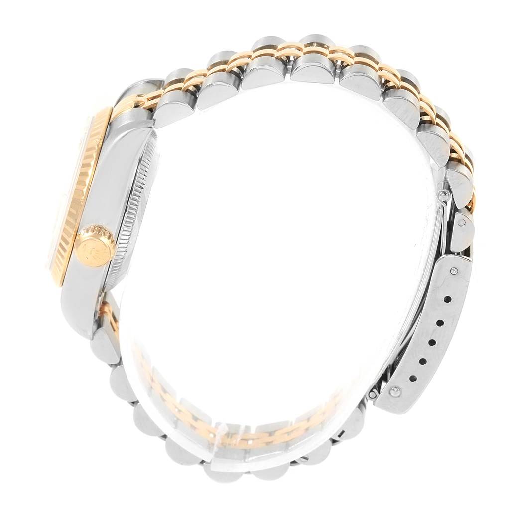 The image shows a side view of a Rolex Datejust 69173 Women's Stainless Steel Champagne Dial 69173 Women's Stainless Steel Champagne Dial watch, highlighting its crown, case, and two-tone bracelet.