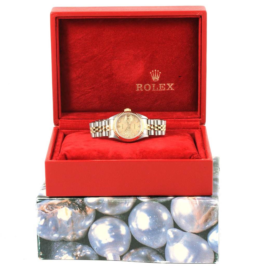 The Rolex Datejust 69173 Women's Stainless Steel Champagne Dial 69173 Women's Stainless Steel Champagne Dial watch is displayed front-on, nestled in a red velvet box, showcasing its face and bracelet.