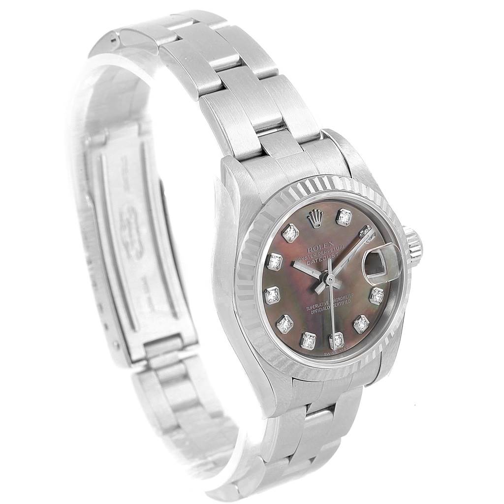 This image shows a Rolex Datejust 79174 Women
s Stainless Steel Mother of Pearl Dial 79174 Women
s Stainless Steel Mother of Pearl Dial watch from a slight side angle, highlighting the face, bezel, and bracelet.