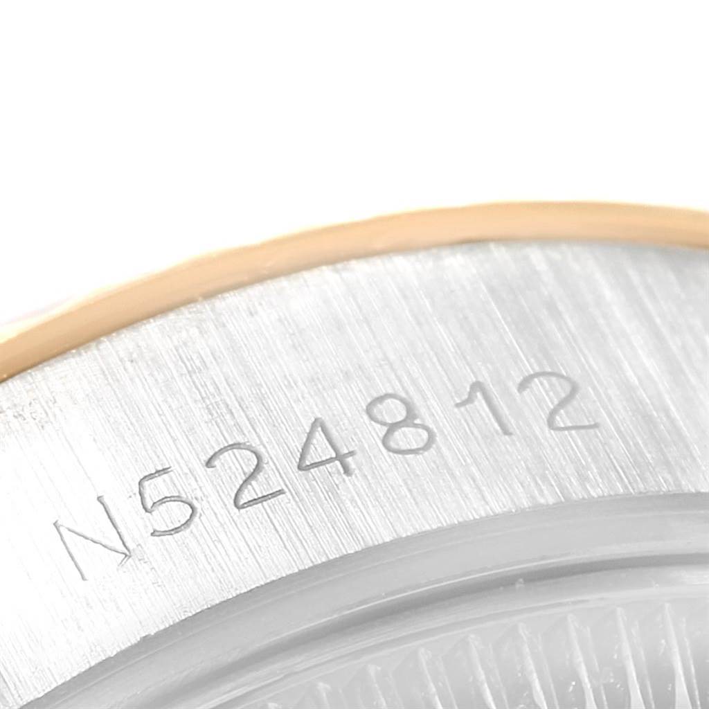 The image shows a close-up of the serial number engraving on the side of the bezel of a Rolex Datejust 69173 Women
s Stainless Steel White Dial 69173 Women
s Stainless Steel White Dial watch.